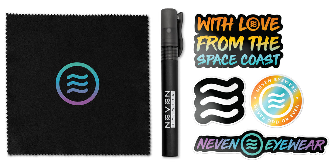 Top-down of Pen Style Cleaning Kit with 10 ml spray pen, black cleaning cloth with logo and stickers on white background