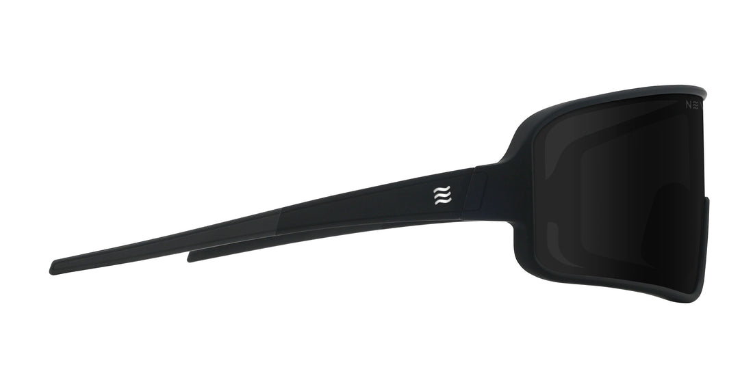 Side view of Resilience sunglasses showcasing black shield lens, matte black temples and wave logo on white background