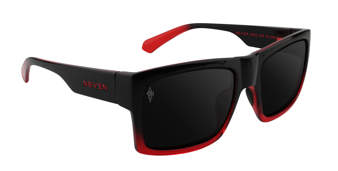 Angled view of Blood Fade sunglasses showing black-to-red fade frame polarized lenses and Gary Holt etched signature on white