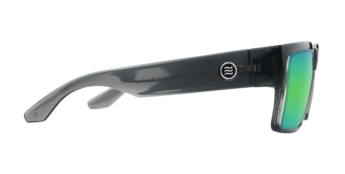 Side view of Banshee sunglasses showcasing transparent gray frame, metal hinge and green mirrored lenses on white background