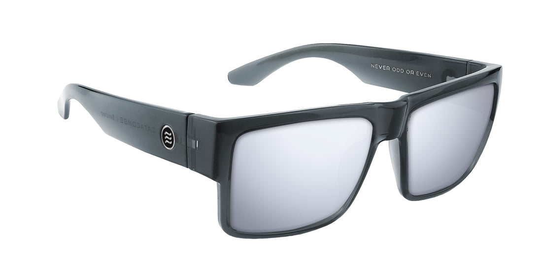 Three-quarter close-up of Banshee sunglasses showing transparent gray frame and silver mirrored prescription lenses
