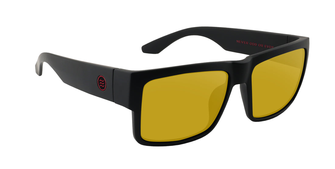 Close-up three-quarter view of Havoc prescription sunglasses showcasing matte black frame and yellow lenses on white background