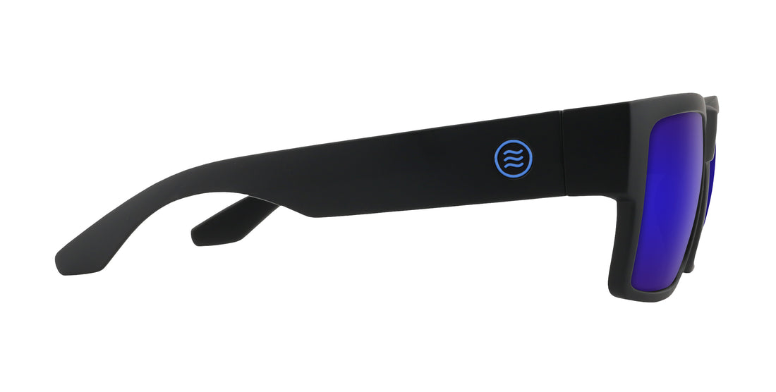Close up side view of Scythe sunglasses showcasing wide matte black temple with blue round logo and purple mirrored prescription lens on white background