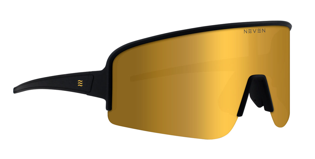 Front three-quarter view of Cadence wraparound polarized sunglasses showcasing gold mirrored lens and black frame on white background