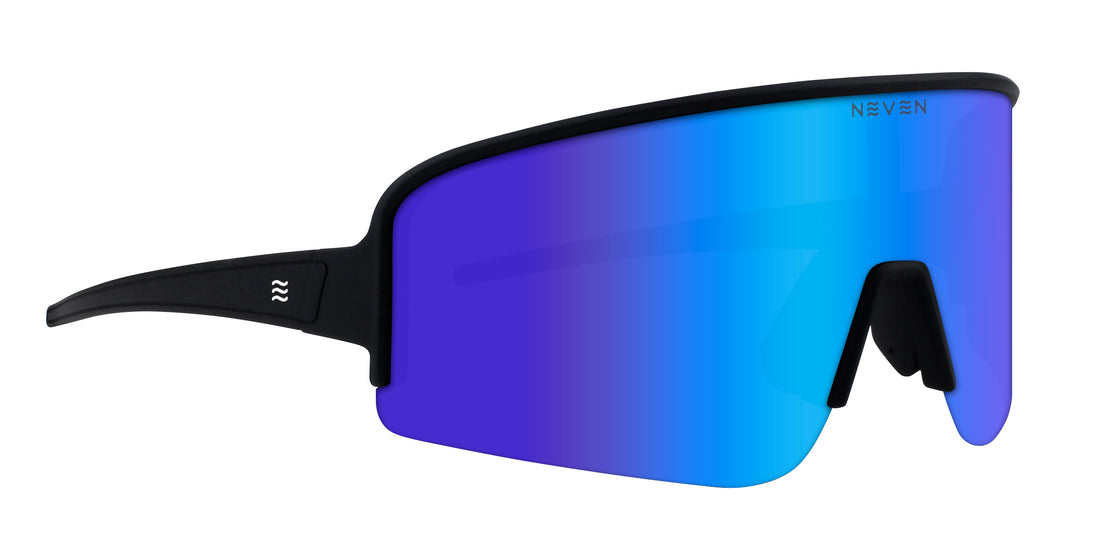 Front three-quarter view of Cadence polarized shield sunglasses with black frame and blue-purple mirrored lens on white background