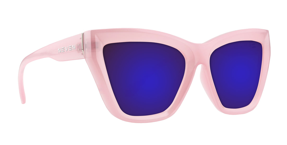 Right-front close-up of Eclipse sunglasses showing semi-transparent pink cat-eye frames and purple lenses on white background