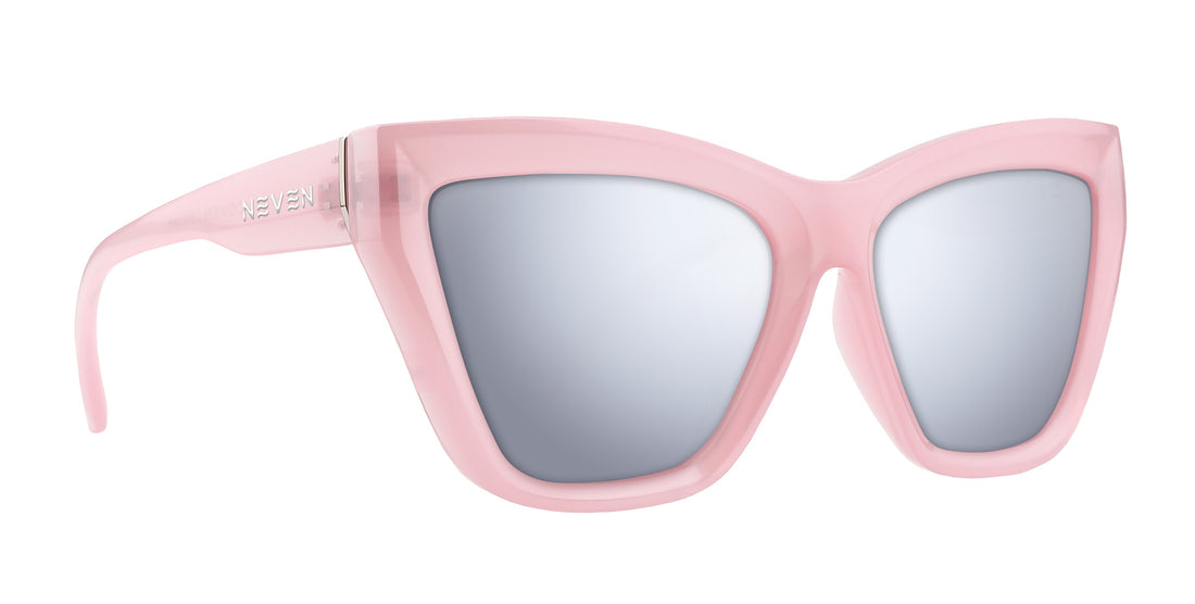 Close-up angled view of Eclipse prescription sunglasses showing semi-transparent pink cat-eye frame, mirrored prescription lenses, Neven logo on temple, white background