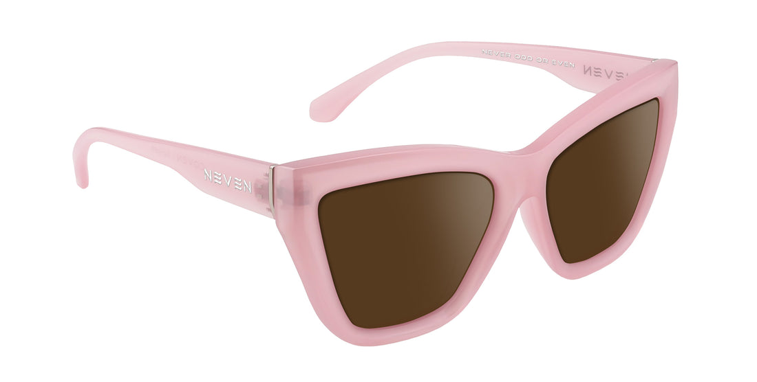 Angled close-up of Eclipse sunglasses showing pink cat-eye frame, brown lenses and NEVEN logo