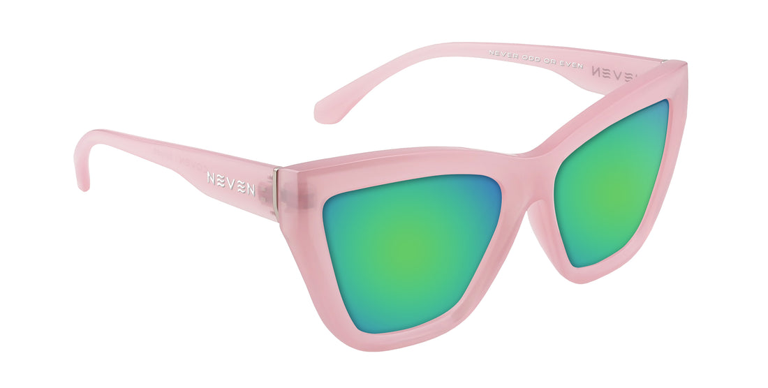 Close-up three-quarter view of Eclipse cat-eye sunglasses with semi-transparent pink glossy frames and green mirrored lenses