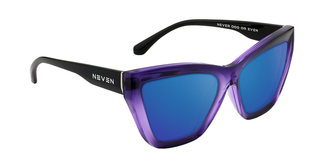 Three-quarter view of Ethereal prescription cat-eye sunglasses showcasing glossy purple gradient frames and blue mirrored lenses on a white background