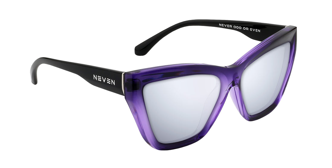 Angled close-up of Ethereal cat-eye glasses showcasing glossy purple gradient frames and silver mirrored lenses on white