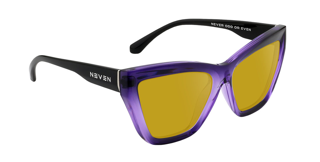 Angled close-up of Ethereal cat-eye sunglasses showcasing glossy purple gradient frame and yellow lenses on white background