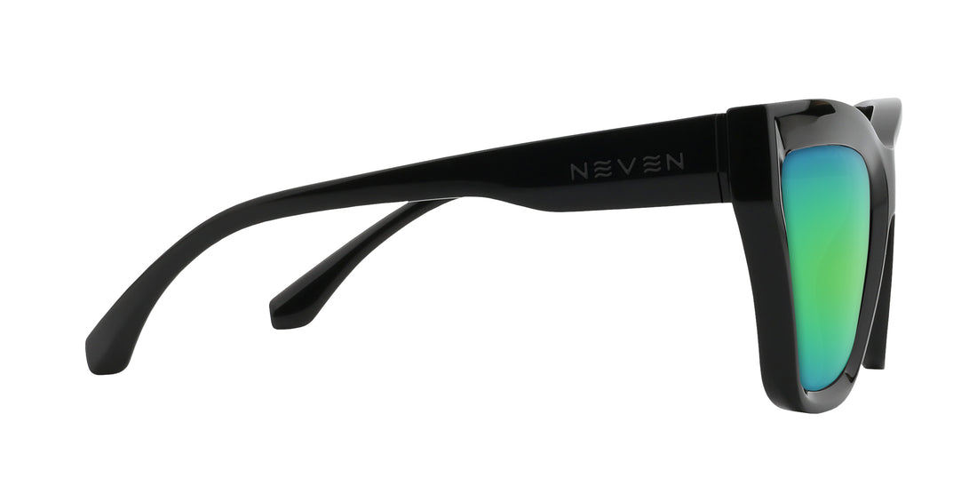Close up side view of Nocturnal Rx sunglasses showcasing glossy black cat eye frame and green mirrored lens on white