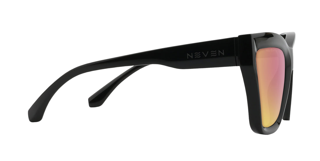 Side view of Nocturnal cat-eye prescription sunglasses showing glossy black frame, Neven logo on temple, and mirrored rose-pink lens on white background