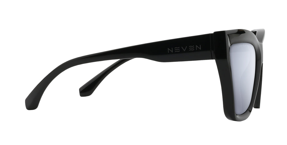 Close-up side view of Nocturnal cat-eye sunglasses showcasing glossy black temple with NEVEN logo and silver prescription lens on white background