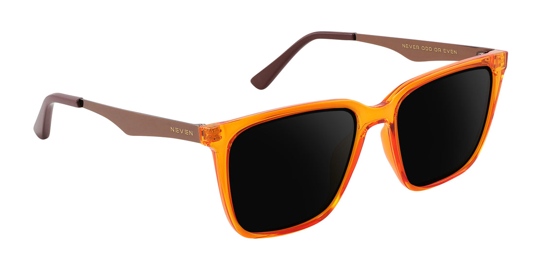 Close-up angle of Java prescription sunglasses showcasing orange-amber transparent frame and bronze metal temples on white background