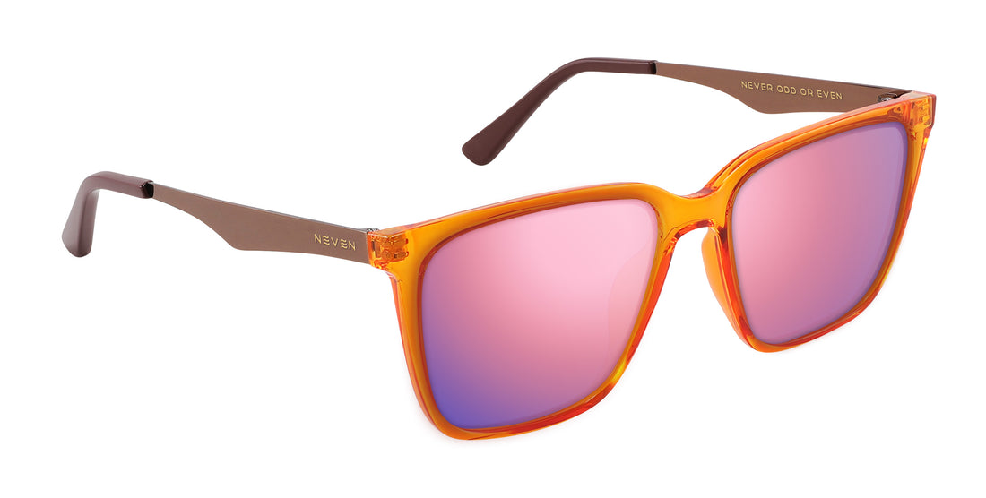 Angled close-up of Java Rx sunglasses with orange-amber transparent frames, bronze temples and pink mirrored lenses