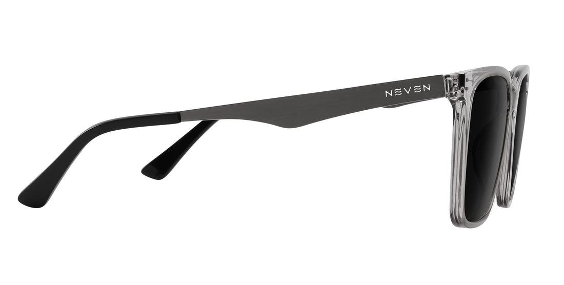 Side view of Tornado prescription sunglasses showcasing transparent gray frames and silver metallic temples on white background