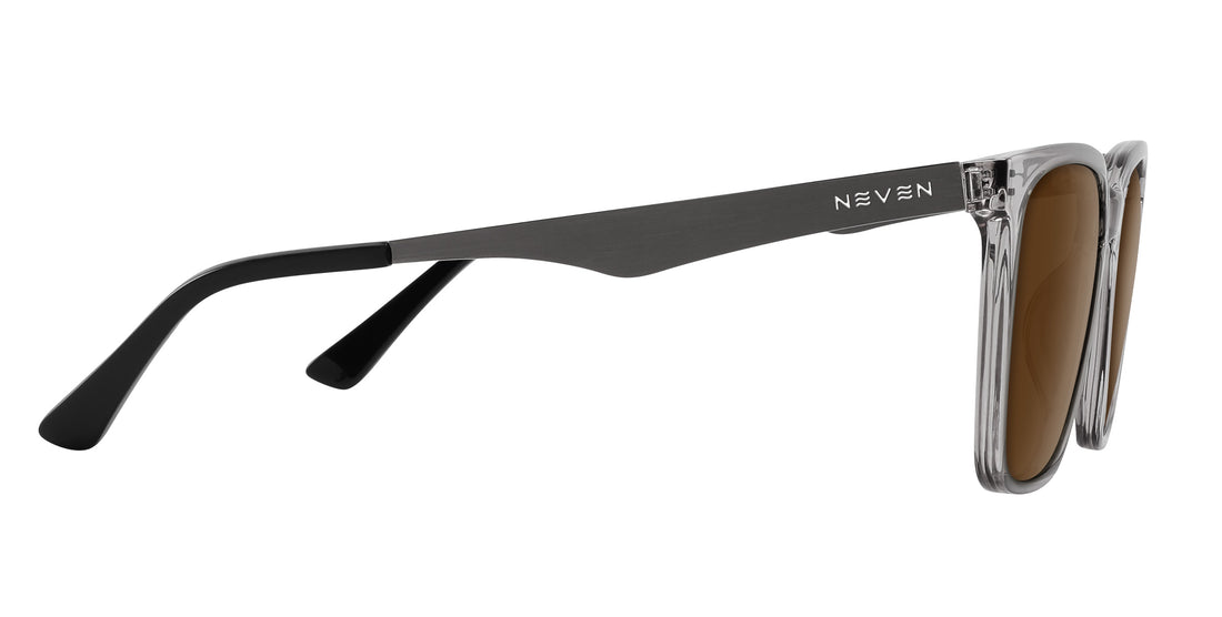 Three-quarter side view of Tornado prescription sunglasses showcasing brown lenses, transparent gray frames, and silver metallic temples on white