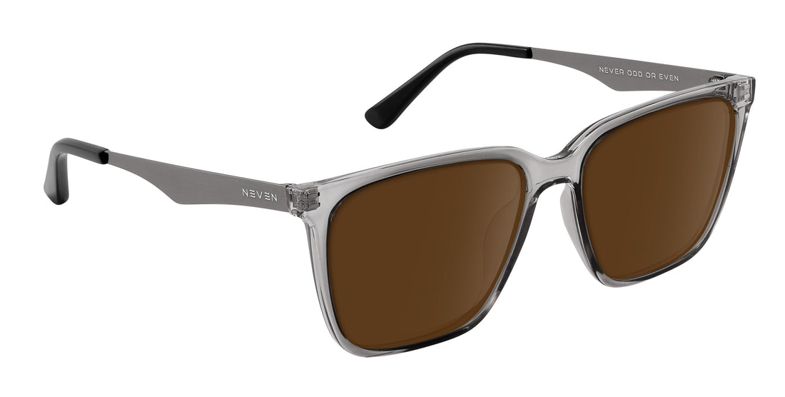 Three-quarter view of Tornado prescription sunglasses showcasing transparent gray frames, silver temples, and brown lenses on white