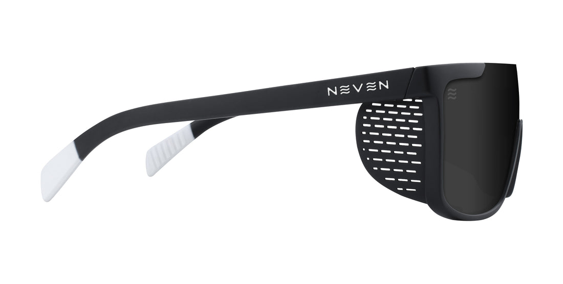 Side view of Pitch Black sunglasses with removable perforated side shield and matte black temple with Neven logo on white background