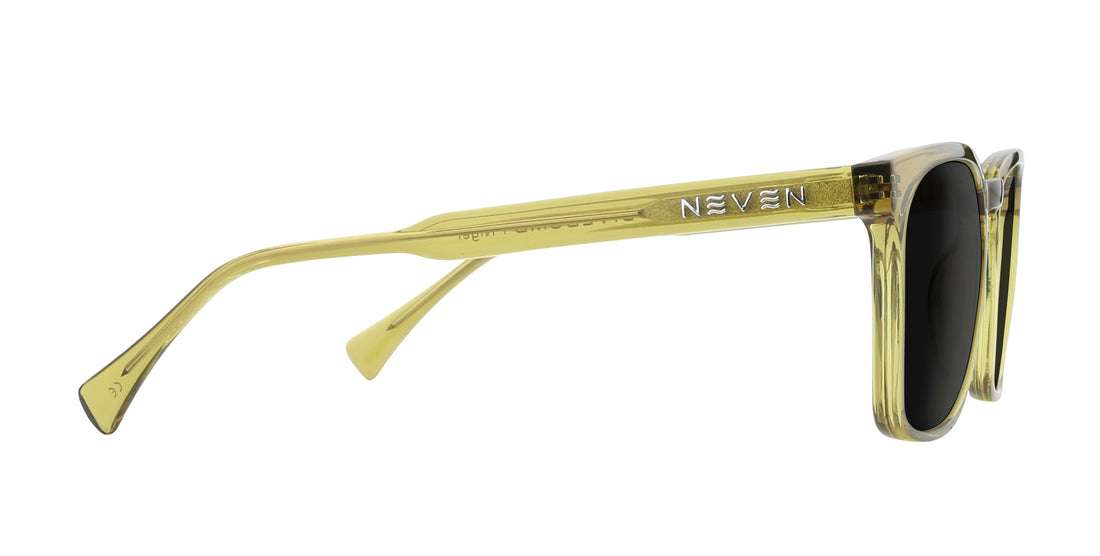 Side view of Nigel prescription rectangular sunglasses showcasing transparent olive green frame and silver NEVEN logo on the temple against a white background