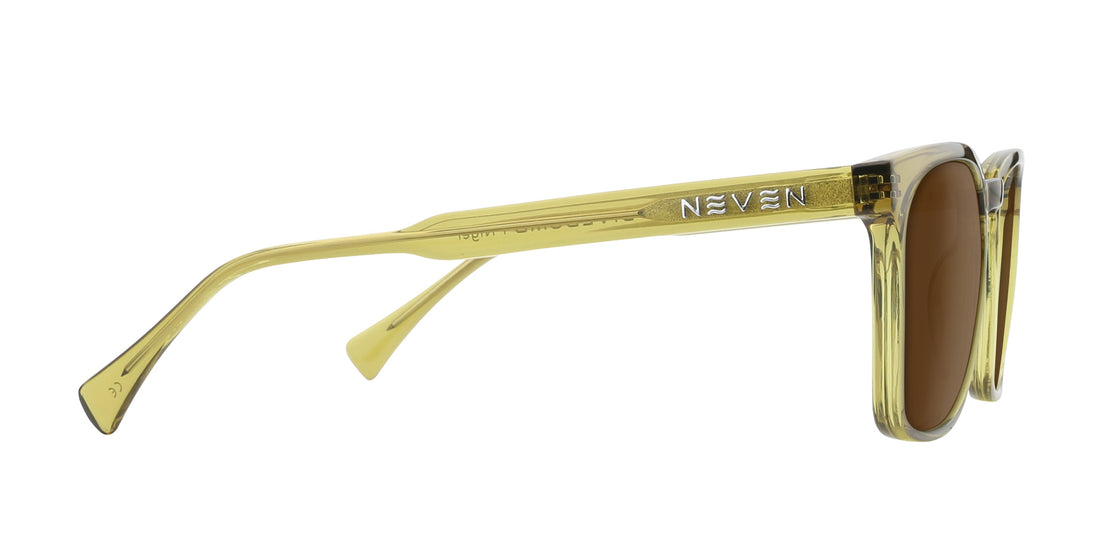 Side view of Nigel Rx sunglasses with transparent green frame, Neven logo on temple and tinted lenses on white background