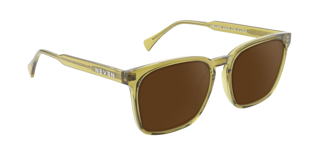 Three-quarter front of Nigel rectangular sunglasses showcasing transparent olive green frame, brown prescription lenses, and Neven logo on temple with white background