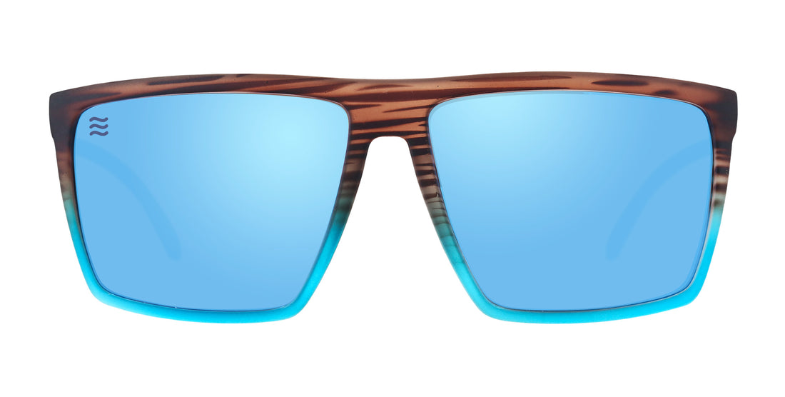 Front view of Melby XL sunglasses showcasing brown tortoise-to-teal fade frame and mirrored blue lenses on white background