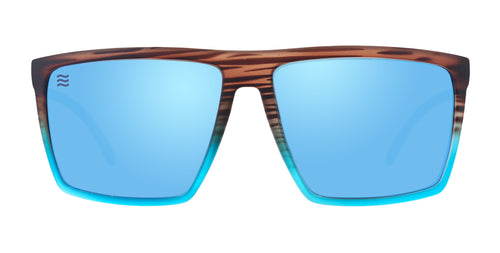 Front view of Melby XL sunglasses showcasing brown tortoise-to-teal fade frame and mirrored blue lenses on white background