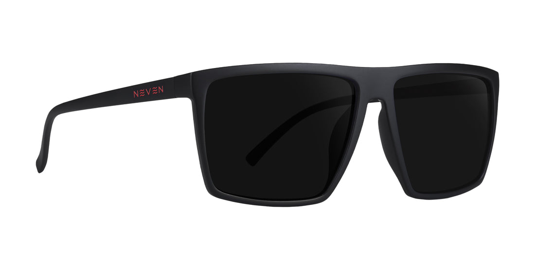 Three-quarter view of 212 sunglasses, matte black rectangular frame with dark prescription lenses and red NEVEN logo on white