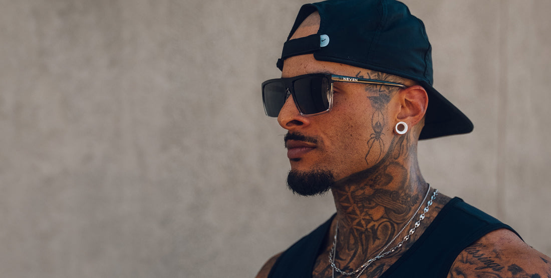Man wearing Colorado Bulldog black rectangular polarized sunglasses in side profile against a neutral background