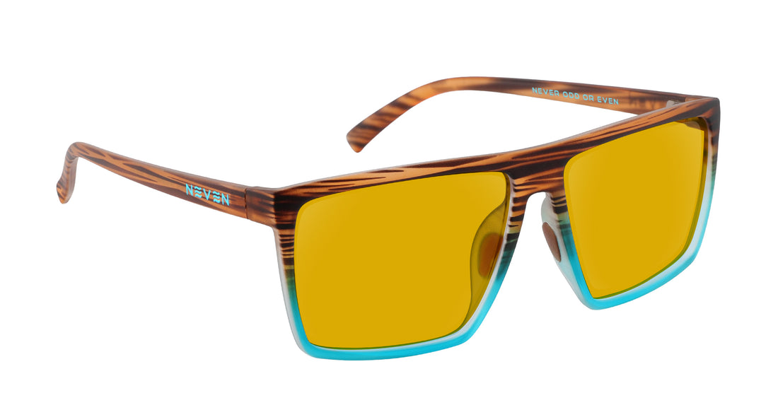 Close-up of Melby prescription sunglasses, woodgrain brown frames with turquoise lower rim and yellow lenses on white