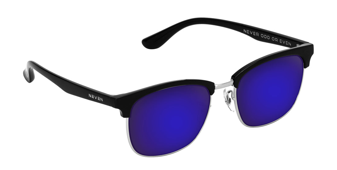 Angled close-up of Bullet prescription sunglasses showcasing black browline TR90 frame and purple mirrored lenses on white background