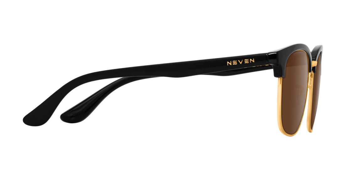Side view of Gold Rush sunglasses with black TR90 temple, gold NEVEN logo and rim, brown prescription lenses on white