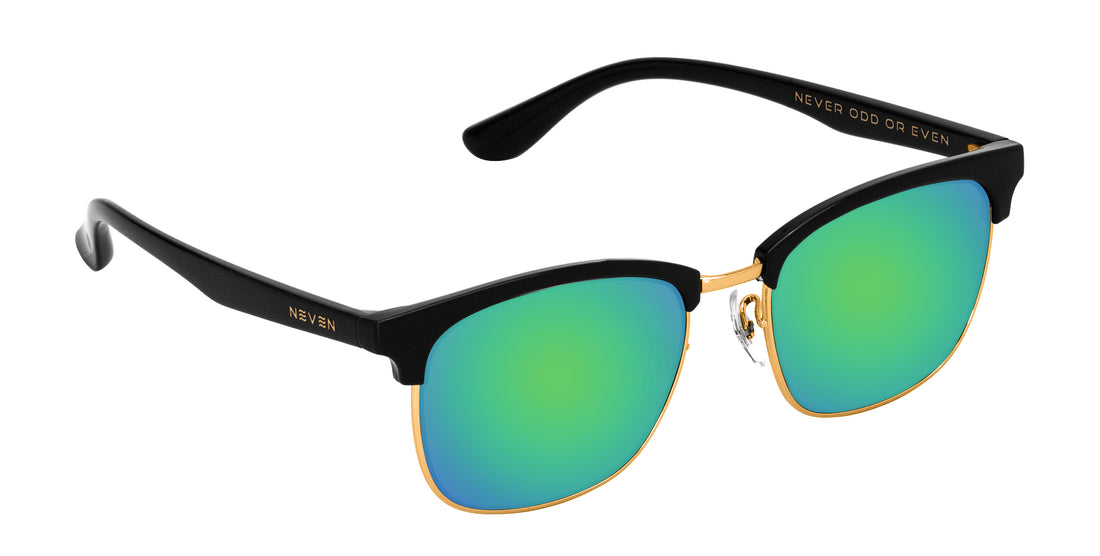 Angled close-up of Gold Rush prescription sunglasses showcasing black TR90 frame, gold rims and green lenses on white