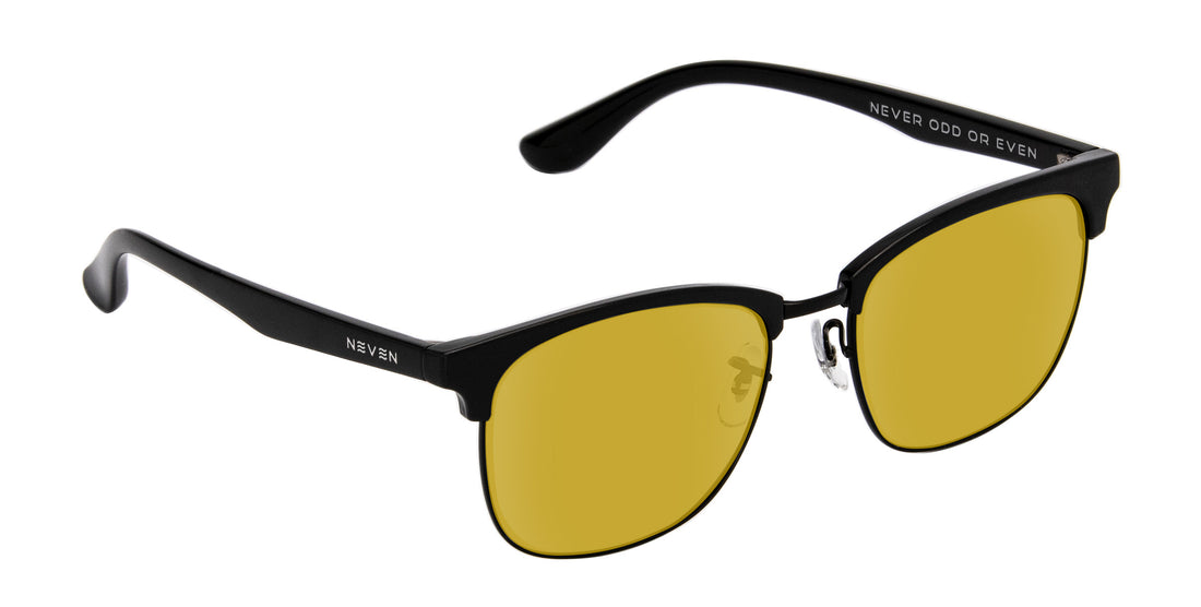Three-quarter view of Stealth prescription Highland sunglasses showcasing black TR90 aviator frame and yellow lenses on white background