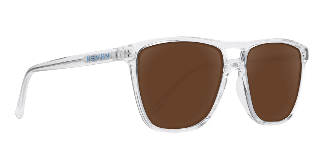 Three-quarter close-up of Lucid prescription sunglasses showing clear frame, brown lenses, and NEVEN logo on white background