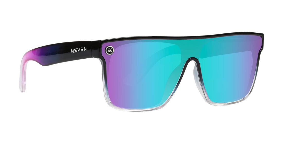 Front-right view of Nomads XL sunglasses with teal-purple mirrored lens and black-to-clear ombre frame on white background