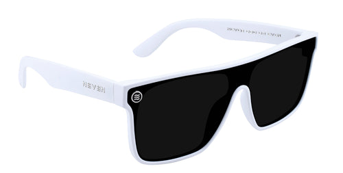 Right close-up of Permafrost XL sunglasses showing gloss white frame, black polarized shield lens, and temple logo