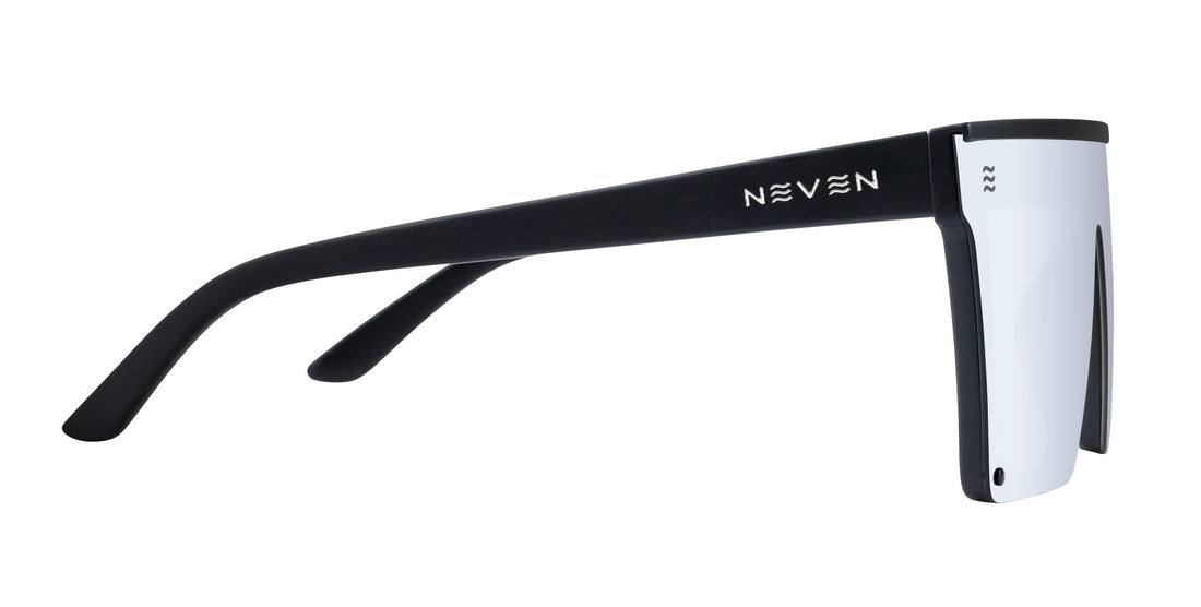 Close-up side view of Cr sunglasses showing matte black temple with Neven logo and silver shield lens on white background