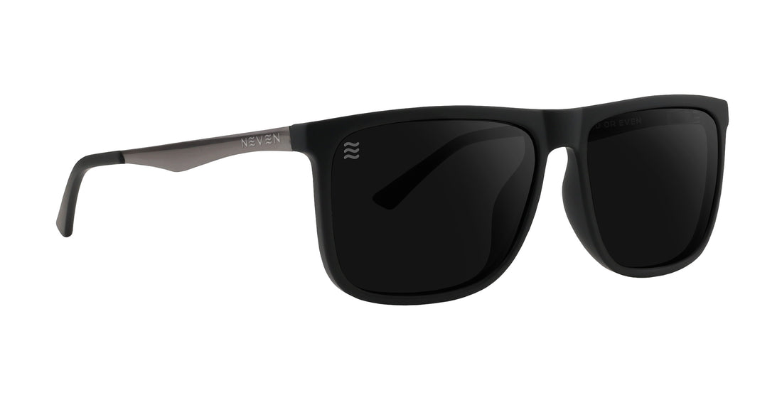Front view of Blueprint sunglasses showcasing black frames and dark lenses with a white background