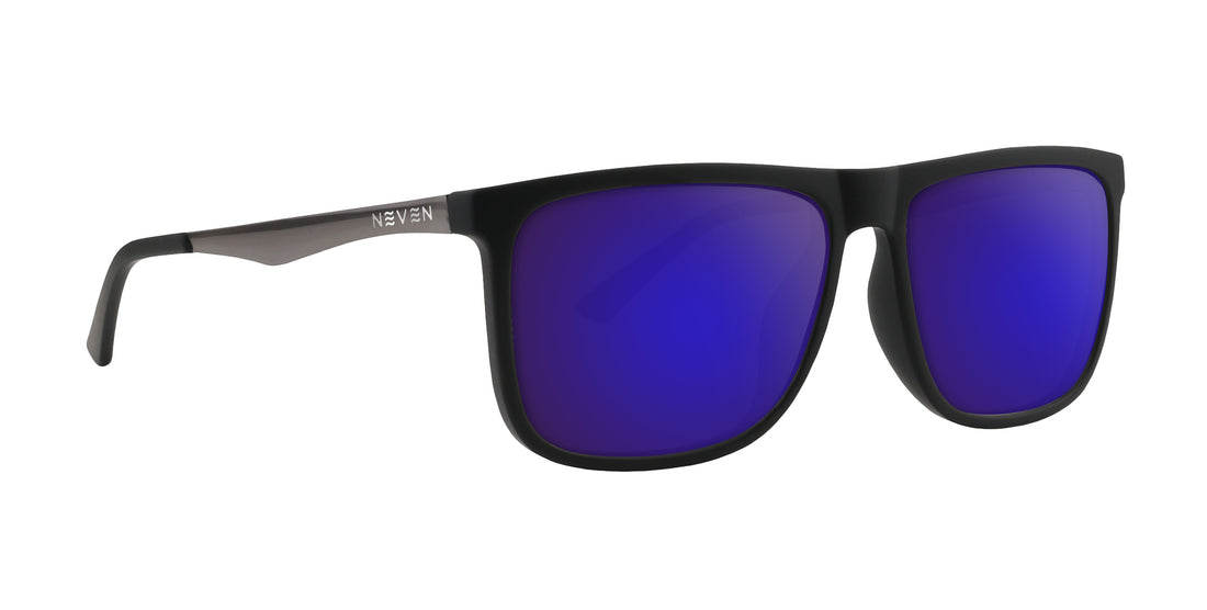 Angled close-up of Blueprint sunglasses showing purple mirrored lenses and matte black rectangular frame on white background