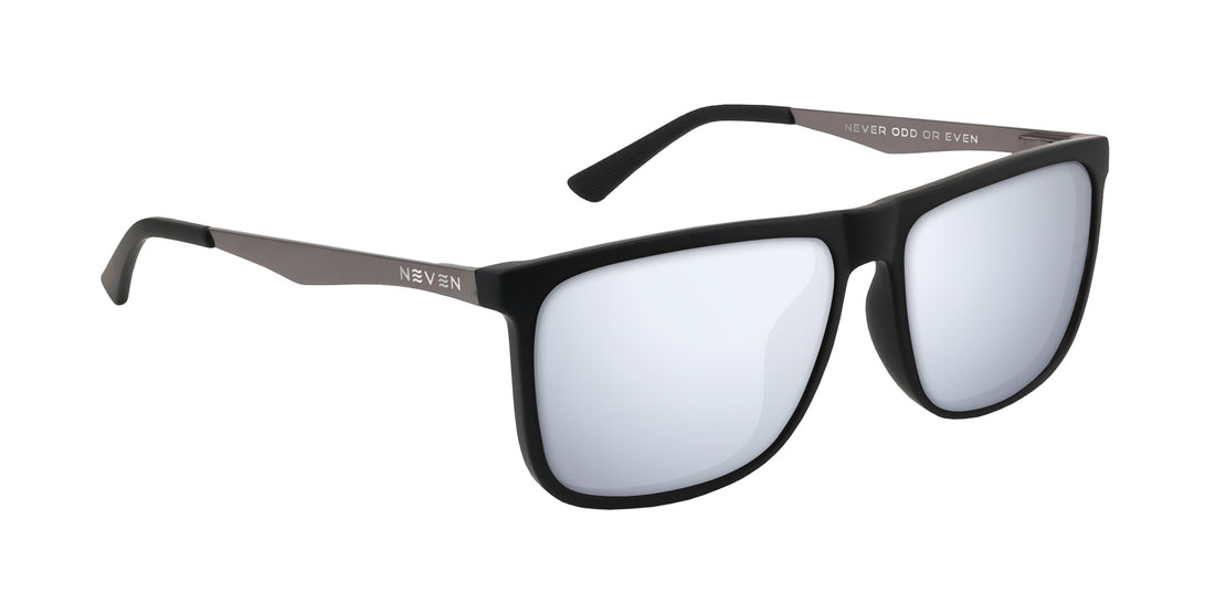 Three-quarter view of Blueprint prescription sunglasses showing matte black rectangular frame, silver mirrored prescription lenses, and Neven logo on gunmetal temples on white background