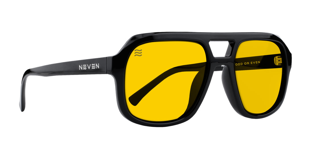 Three-quarter view of Helios sunglasses showcasing a black rectangular frame with yellow polarized lenses on a white background