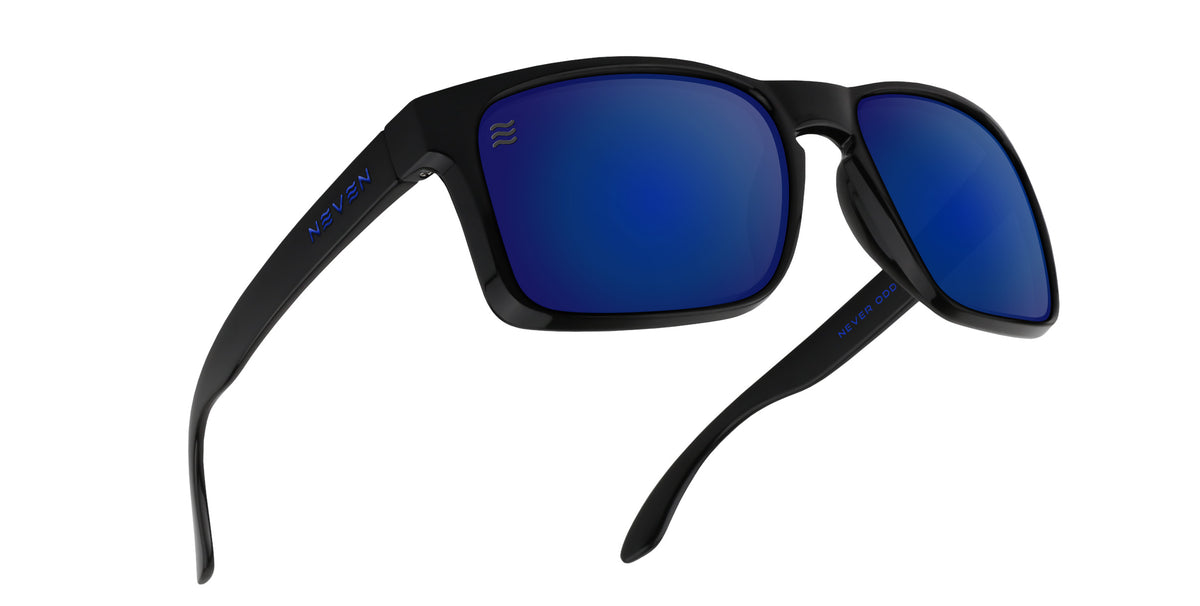Three-quarter close-up of Blue Steel XL sunglasses showcasing glossy black TR90 frame and blue polarized lenses on white background