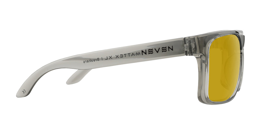 Side closeup of Breakers XL sunglasses showing transparent gray temple with Neven logo and yellow Rx lens on white background