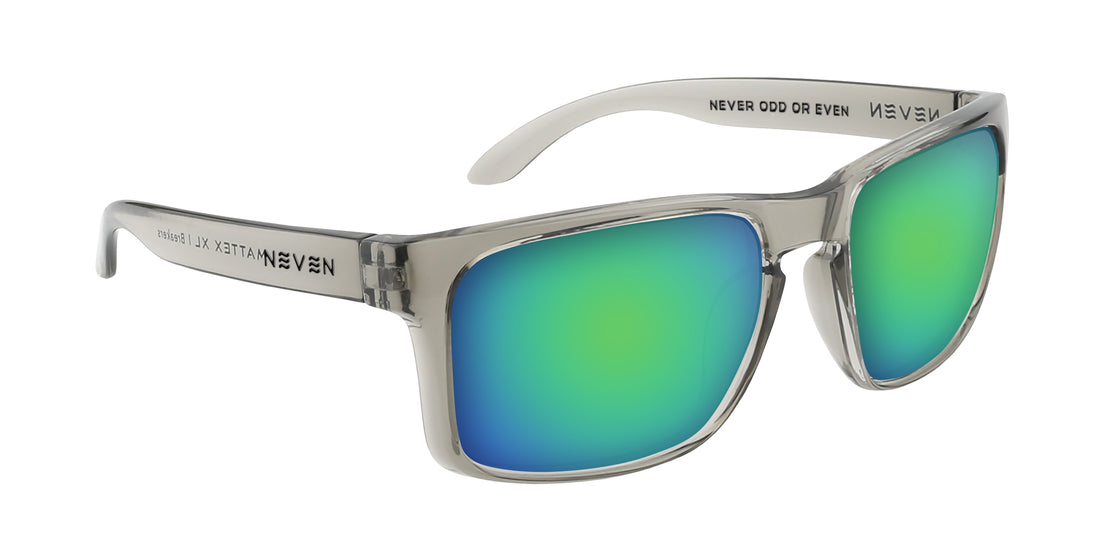 Three-quarter view of Breakers Rx sunglasses showing transparent gray frame and green mirrored lenses