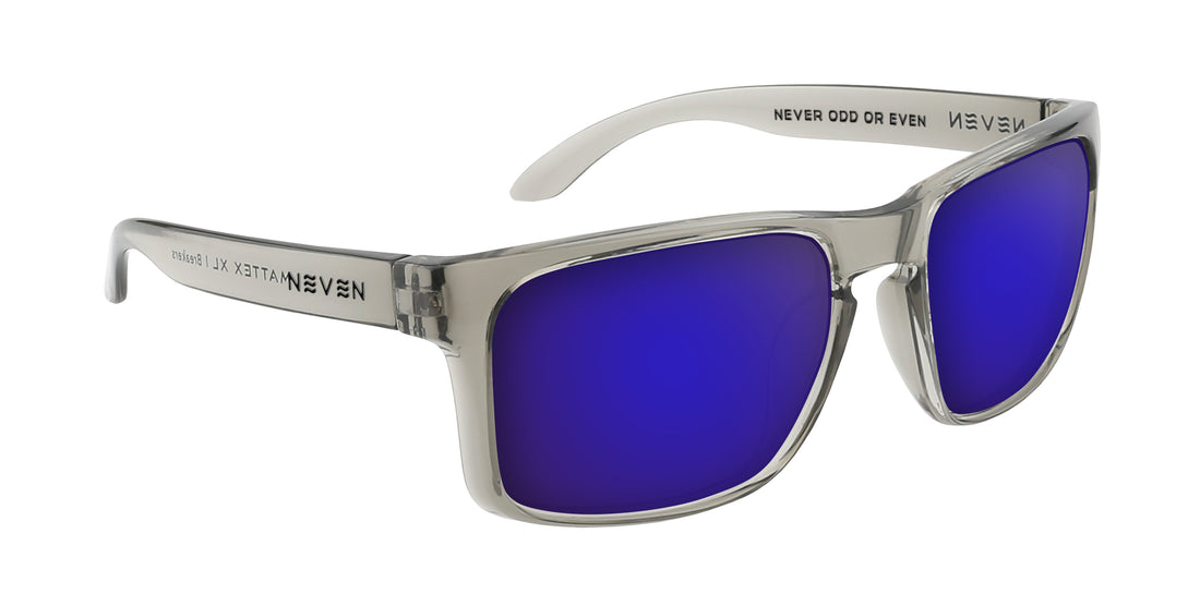 Angled view of Breakers prescription sunglasses with transparent gray frame and purple mirrored lenses on white background