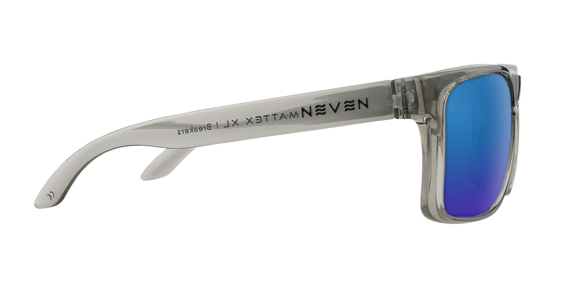 Side view of Breakers XL sunglasses with translucent gray frame, blue mirrored lenses and Neven temple logo on white